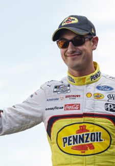LAS VEGAS, NEVADA - OCTOBER 16: Joey Logano, driver of the #22 Shell Pennzoil Ford, waves to fans walks onstage during driver intros prior to the NASCAR Cup Series South Point 400 at Las Vegas Motor Speedway on October 16, 2022 in Las Vegas, Nevada. (Photo by Sean Gardner/Getty Images)